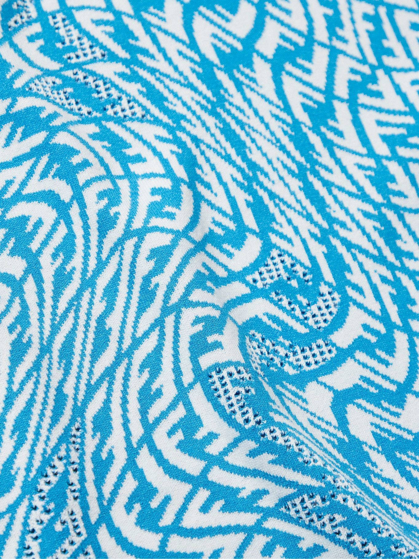 Luxurious Fendi Designer Logo On Knitted Fabric Wallpaper