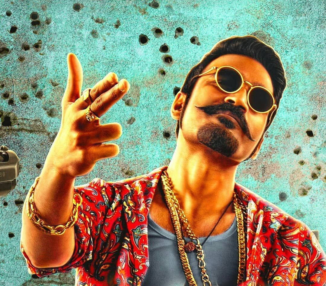 Maari Striking Confident Poses With A Fierce Expression Wallpaper