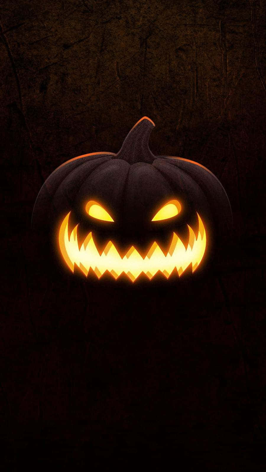 Majestic Carved Pumpkin Glowing In The Night Wallpaper