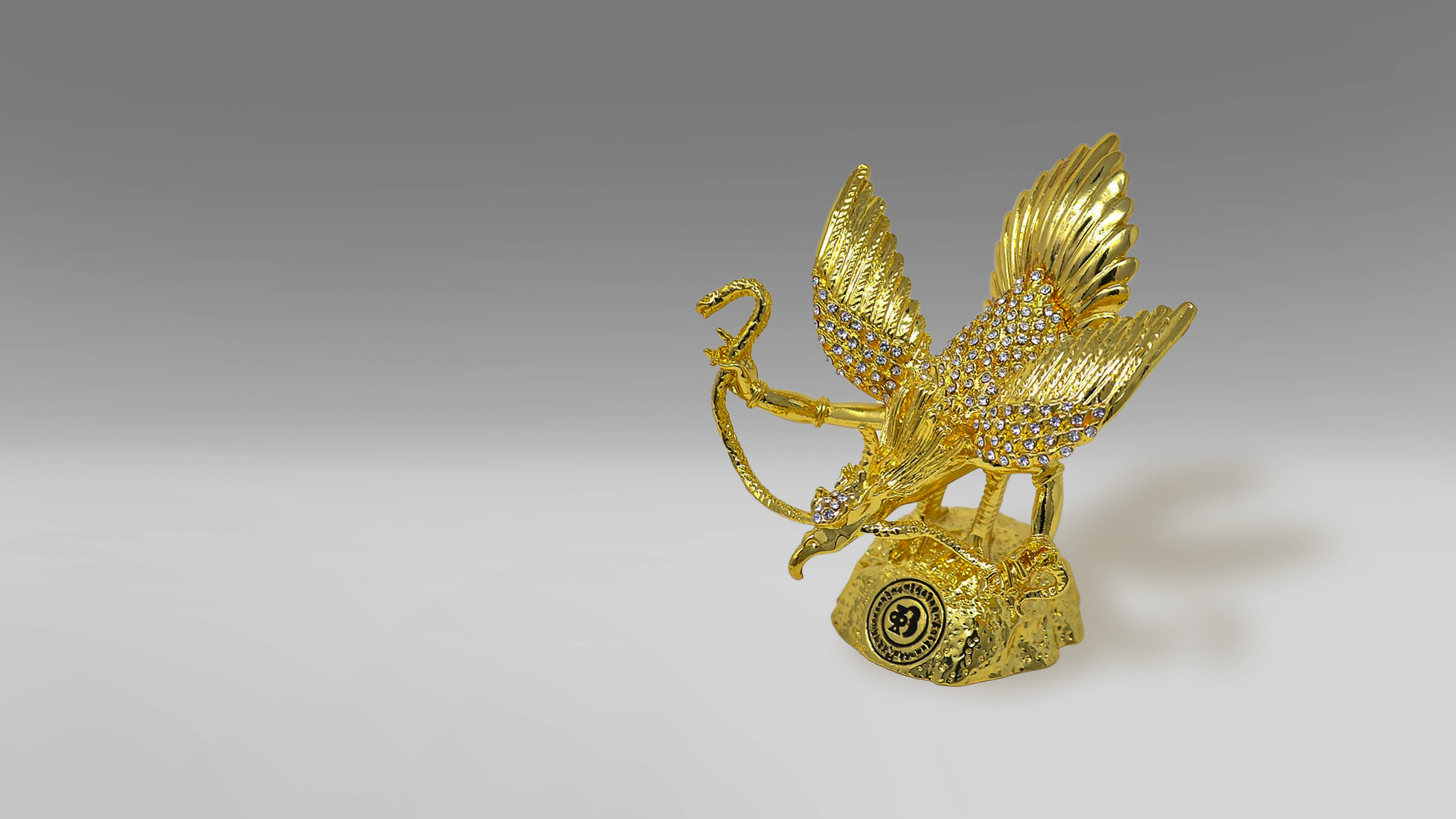 Majestic Golden Garuda In Pristine Splendour Wallpaper