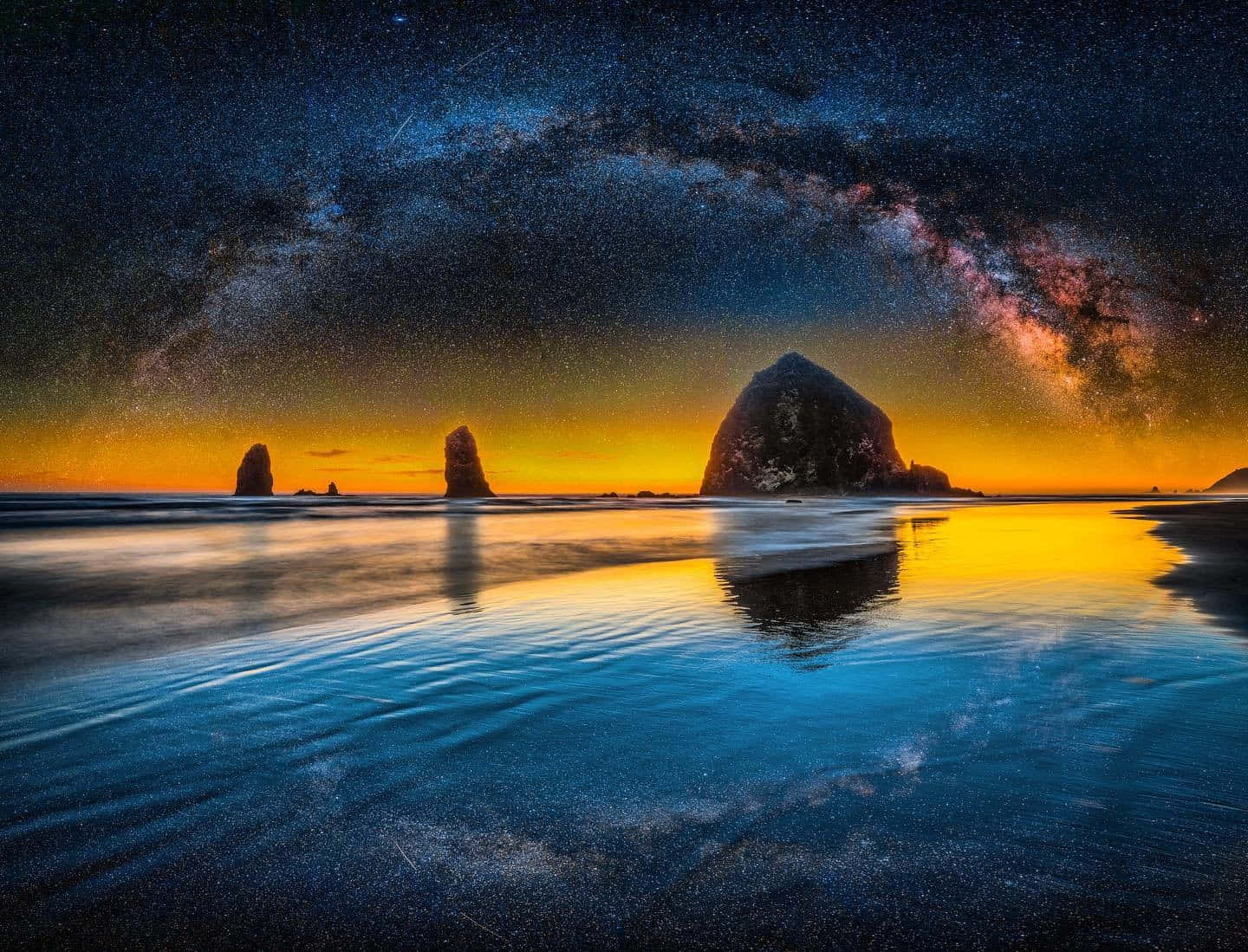 Majestic Haystack Rock On Oregon Beach Wallpaper