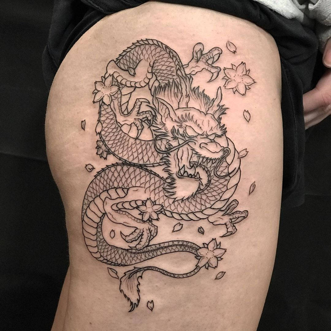 Majestic Japanese Dragon Tattoo Etched On Thigh Wallpaper