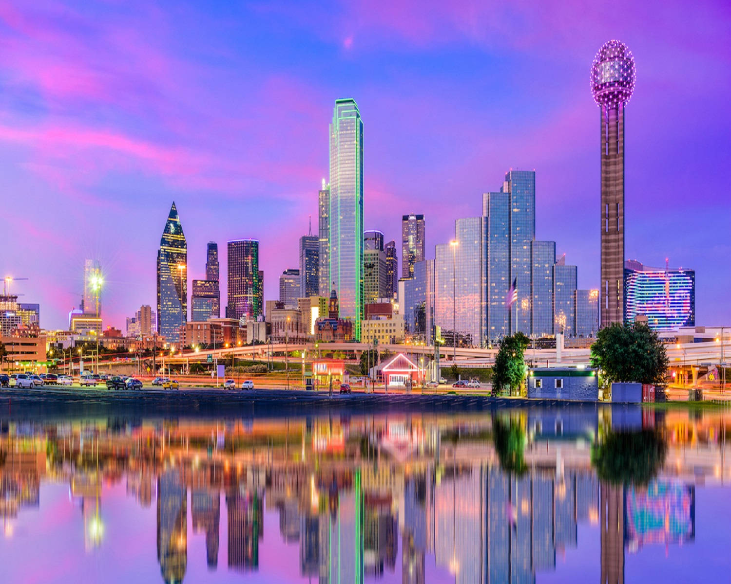 Majestic View Of The Dallas Skyline At Sunset Wallpaper