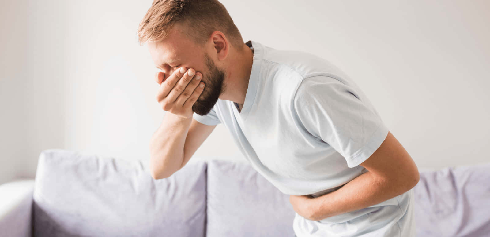 Man In White Shirt Feeling Nauseous Wallpaper