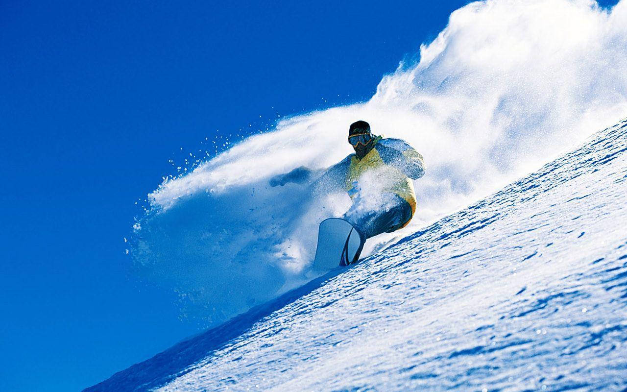 Man With Snowboard And Clouds Of Snow Wallpaper