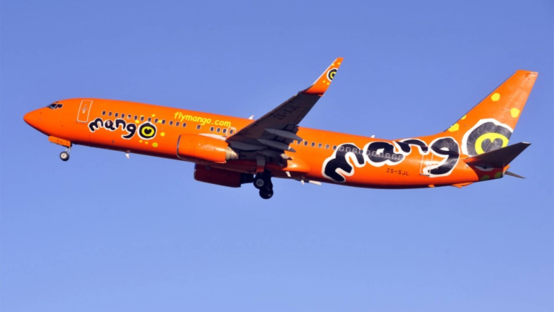 Download free Mango Airlines Plane On Blue Sky Wallpaper MrWallpaper