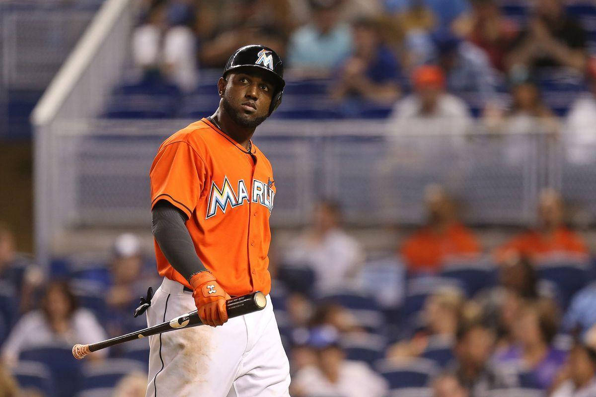 Marcell Ozuna Holding A Black Baseball Bat Wallpaper