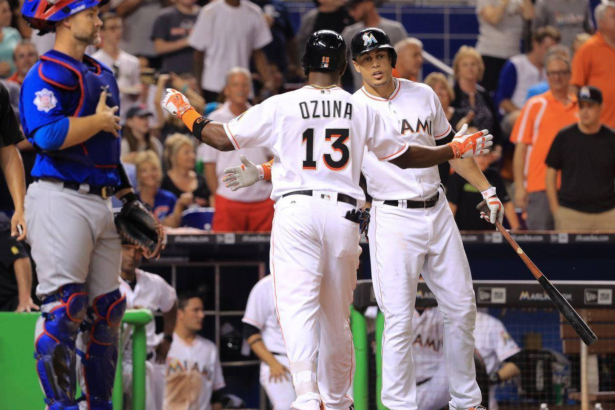 Marcell Ozuna Walking Towards Teammate Wallpaper