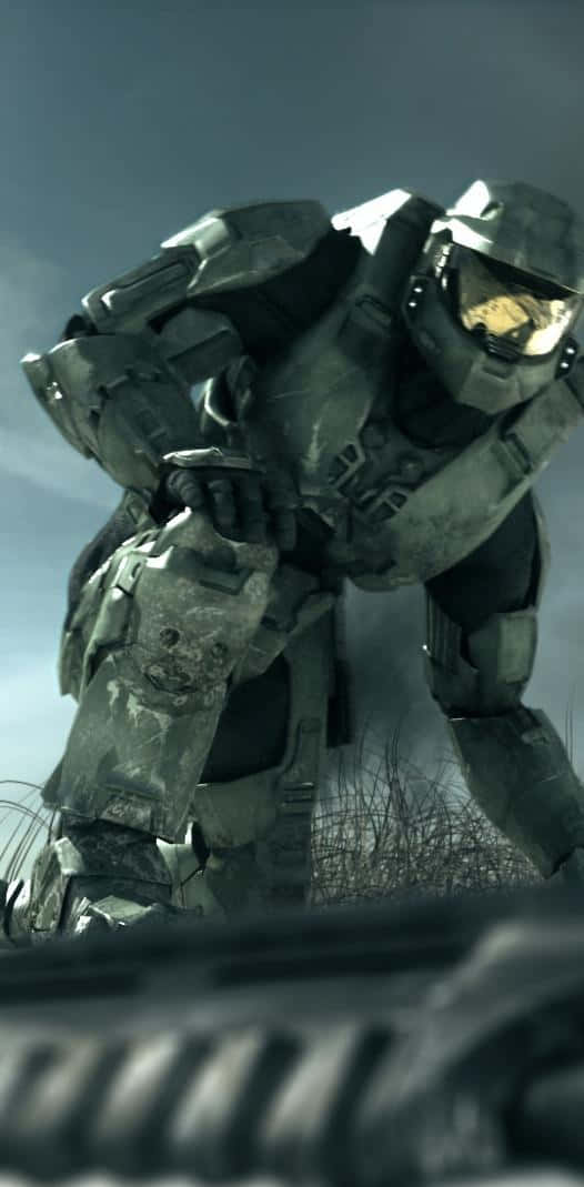 Master Chief And His Trusty Phone Wallpaper