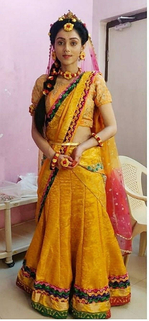 Mesmerizing Mallika Singh In An Elegant Orange Dress Wallpaper