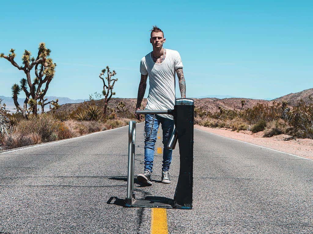 Mgk Standing On The Road Wallpaper