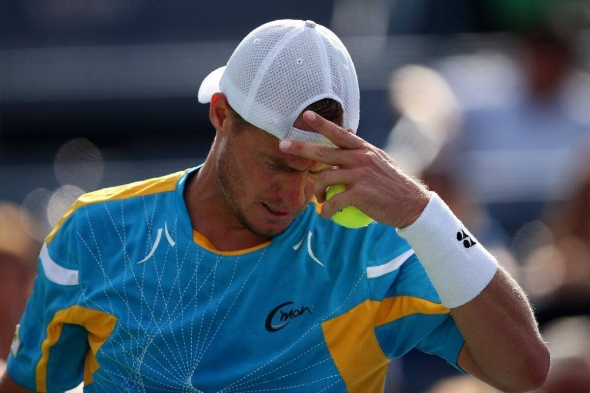 Mikhail Youzhny Holding His Head Wallpaper