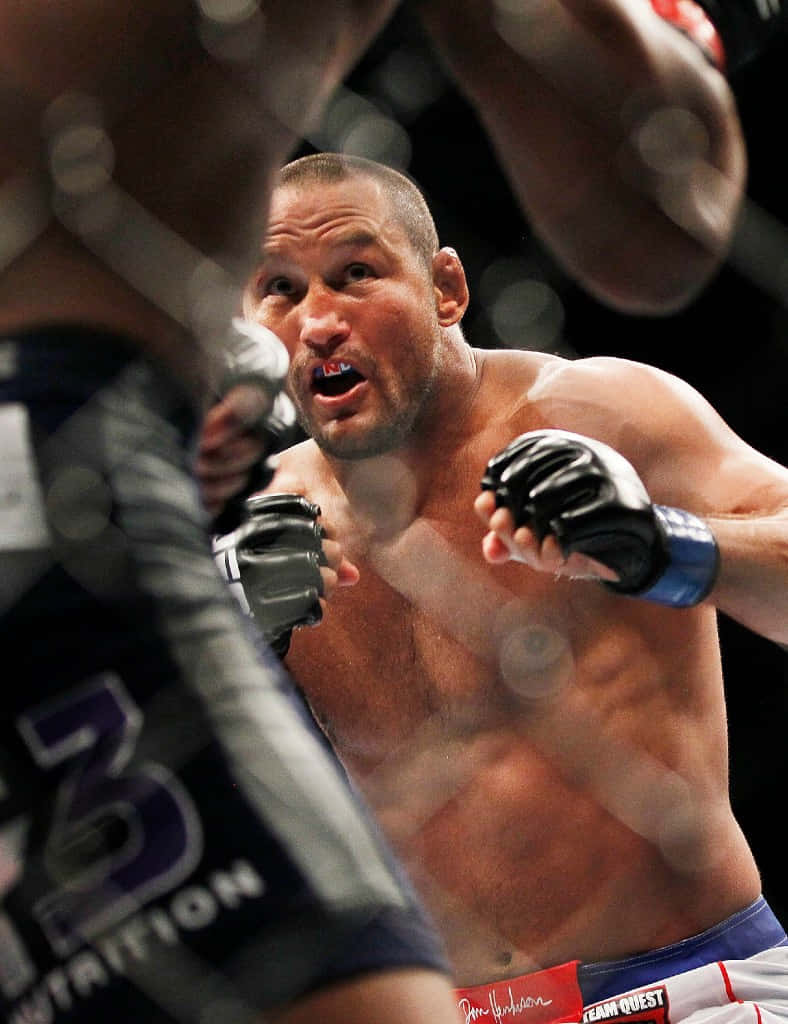 Mixed Martial Artist Dan Henderson Preparing Uppercut Wallpaper