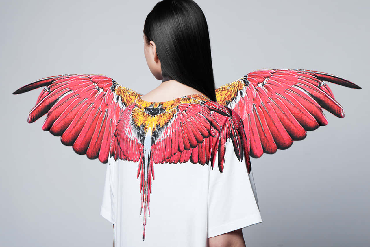 Model Wearing Red Wings Marcelo Burlon Wallpaper