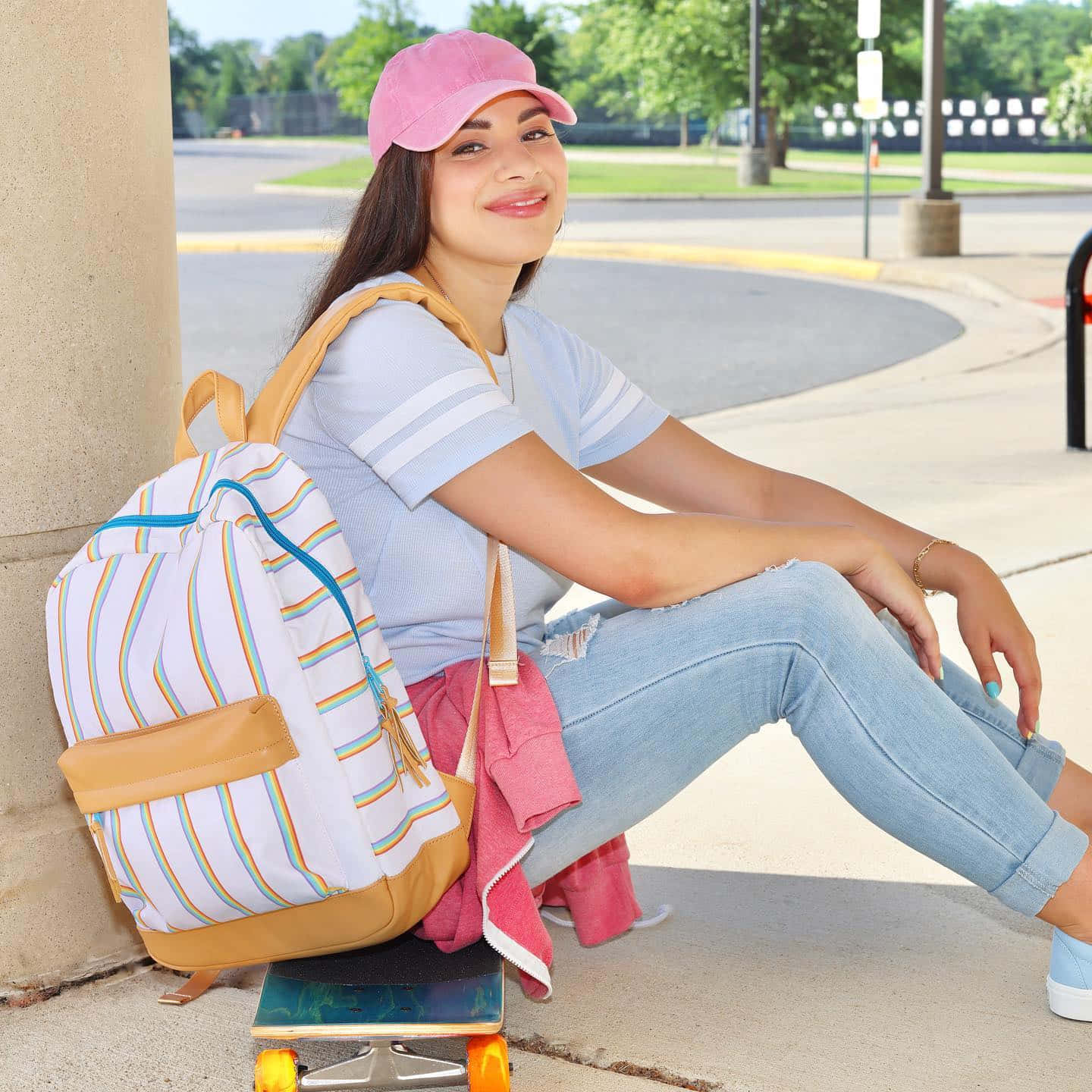 Moriah Elizabeth Sitting On Skateboard Wallpaper