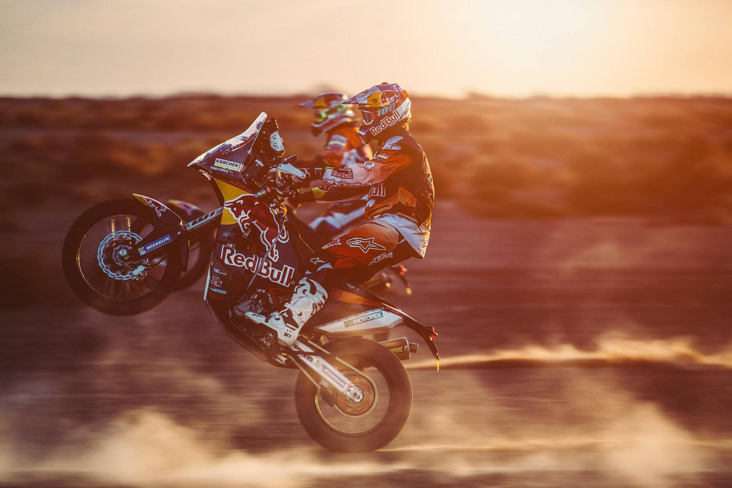 Motocross During Sunset In Dakar Wallpaper