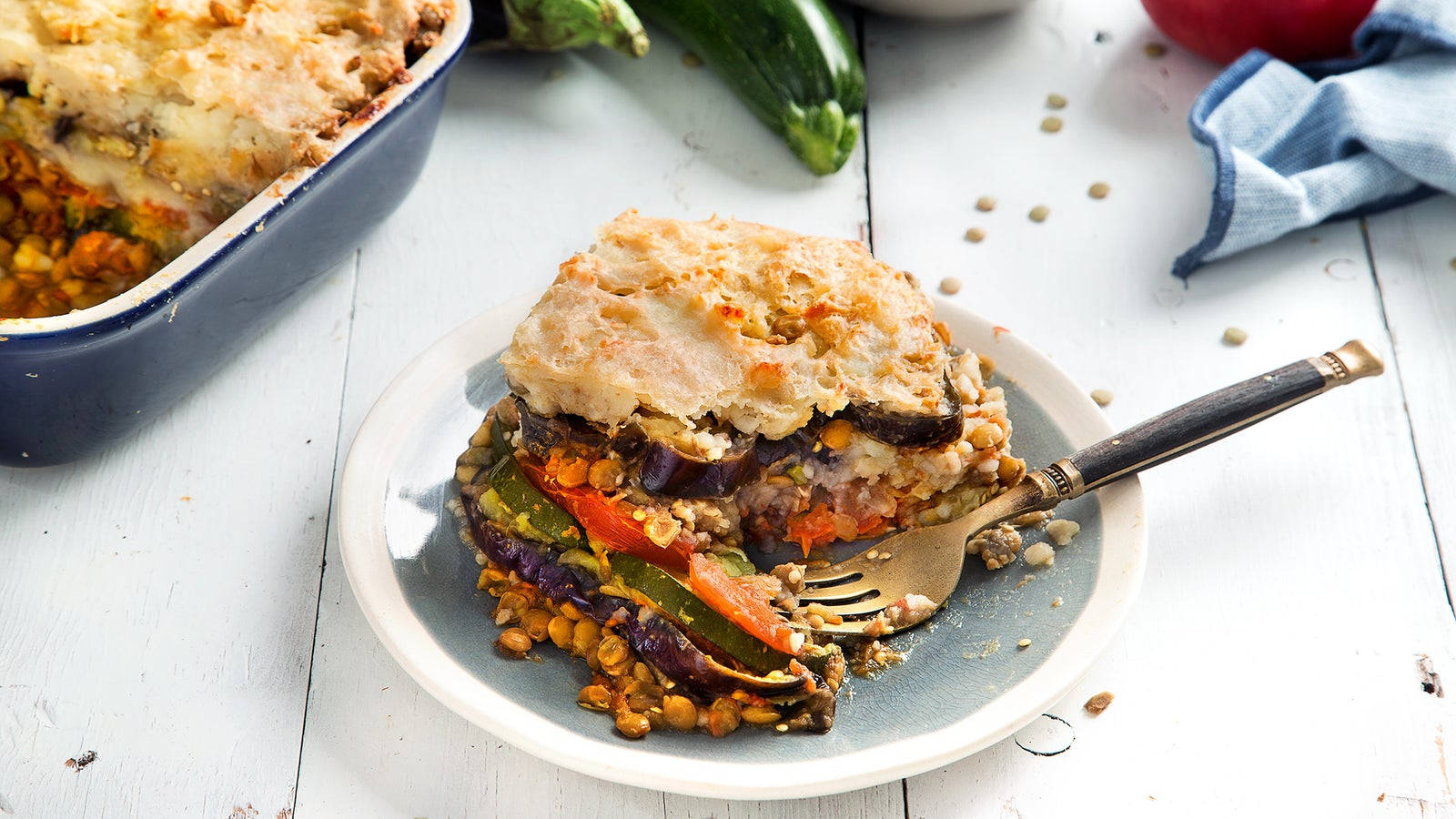 Moussaka Topped With Slices Of Eggplant And Sauce Wallpaper