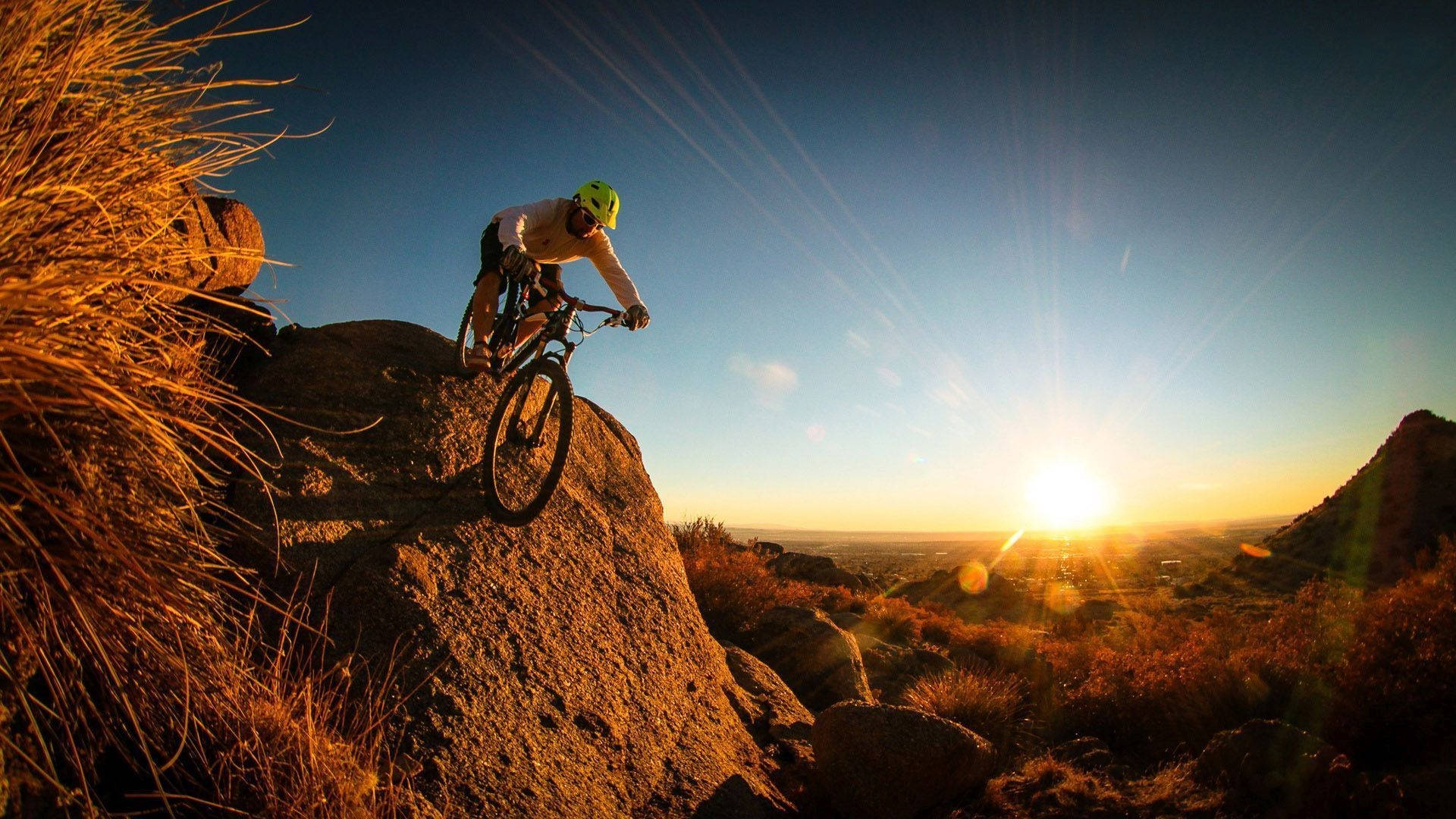 Mtb Riding Rock Boulder Sunset Wallpaper