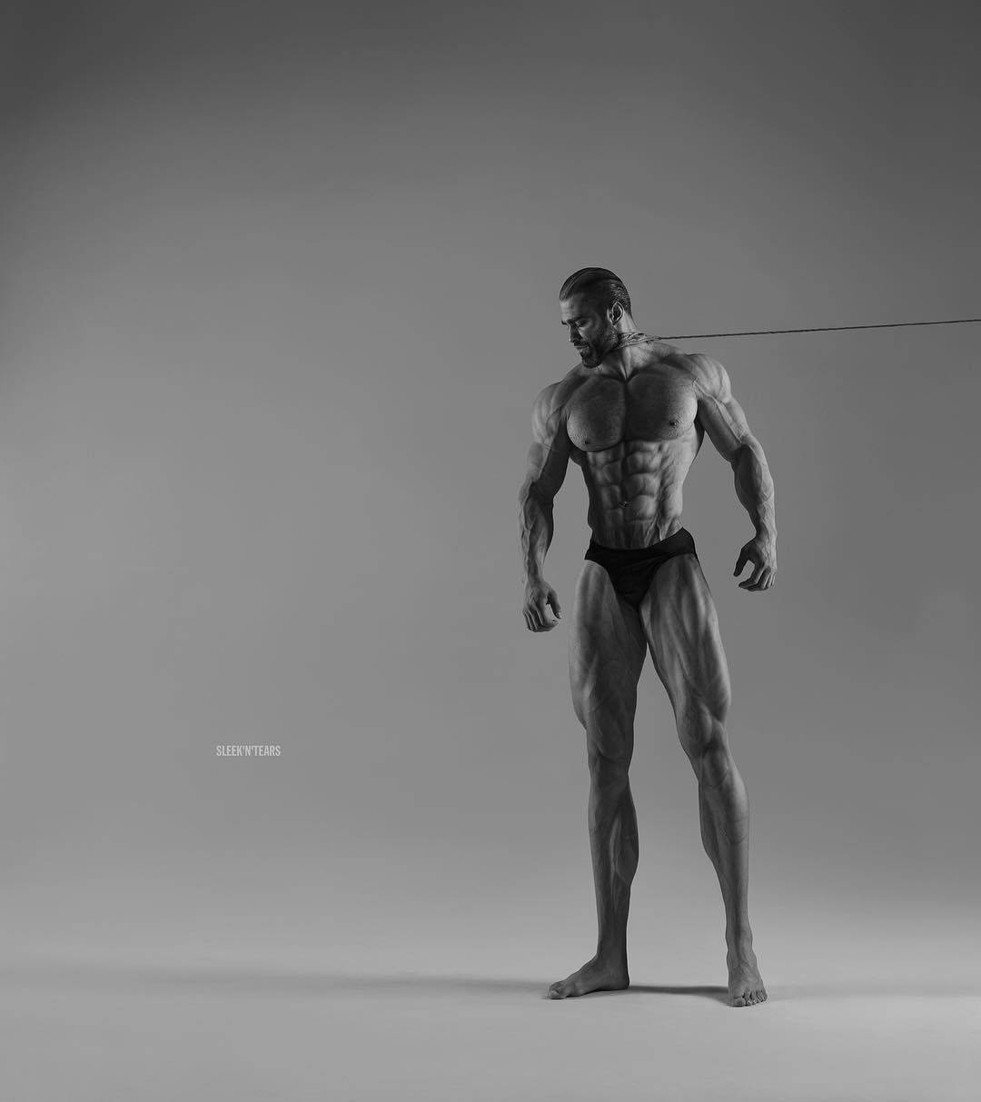 Muscular Model Giga Chad Posing Confidently Wallpaper