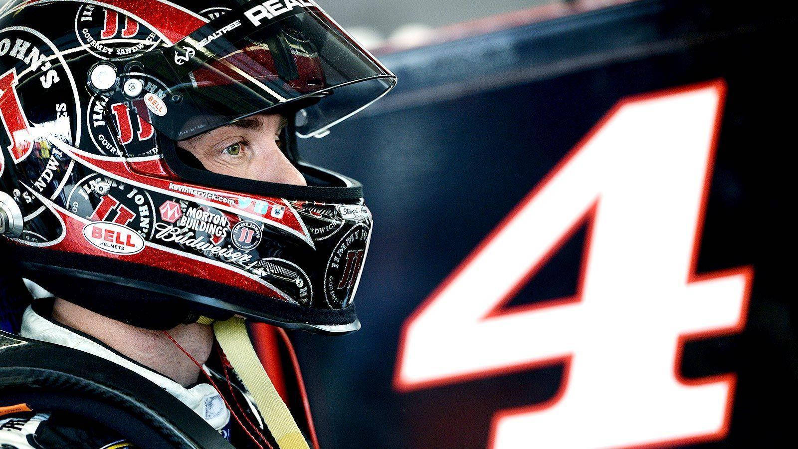 Nascar Driver Kevin Harvick Suited Up With His Helmet On Wallpaper