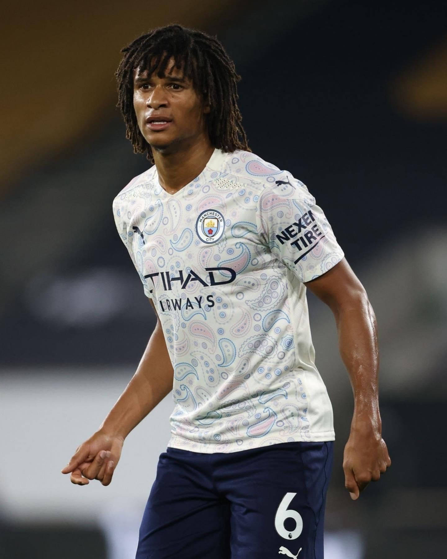 Nathan Ake White Manchester City Jersey Wallpaper