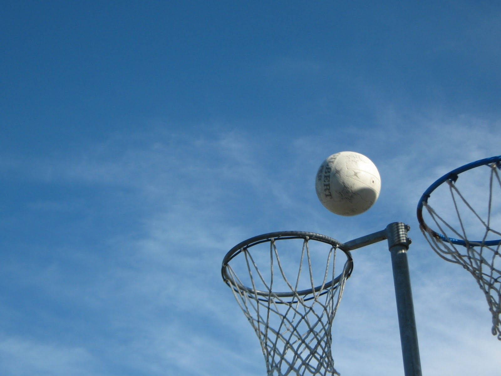 Netball Two Rings Flying Ball Wallpaper