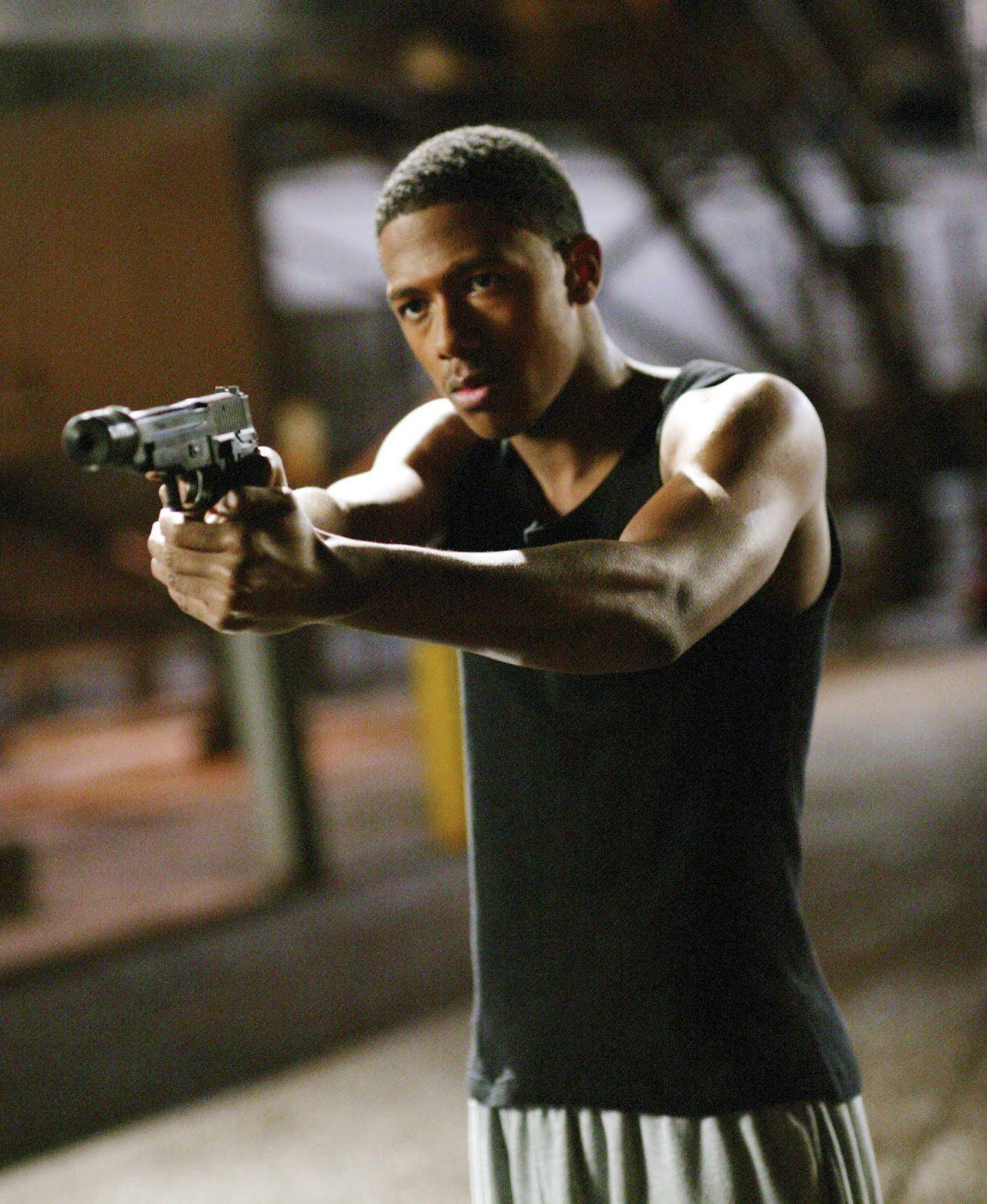 Nick Cannon With Prop Gun Wallpaper