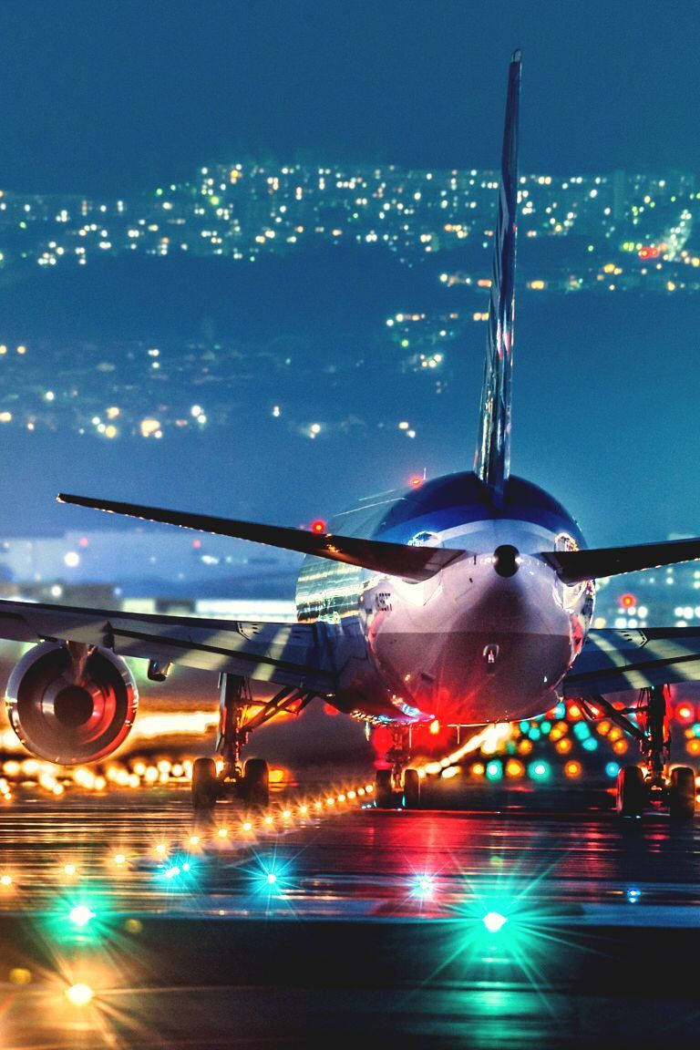 Night At The Runway With Jet Iphone Wallpaper
