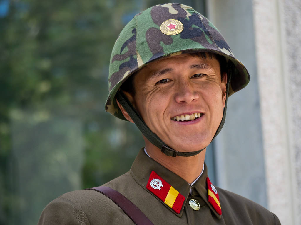 North Korea Soldier With Big Smile Wallpaper