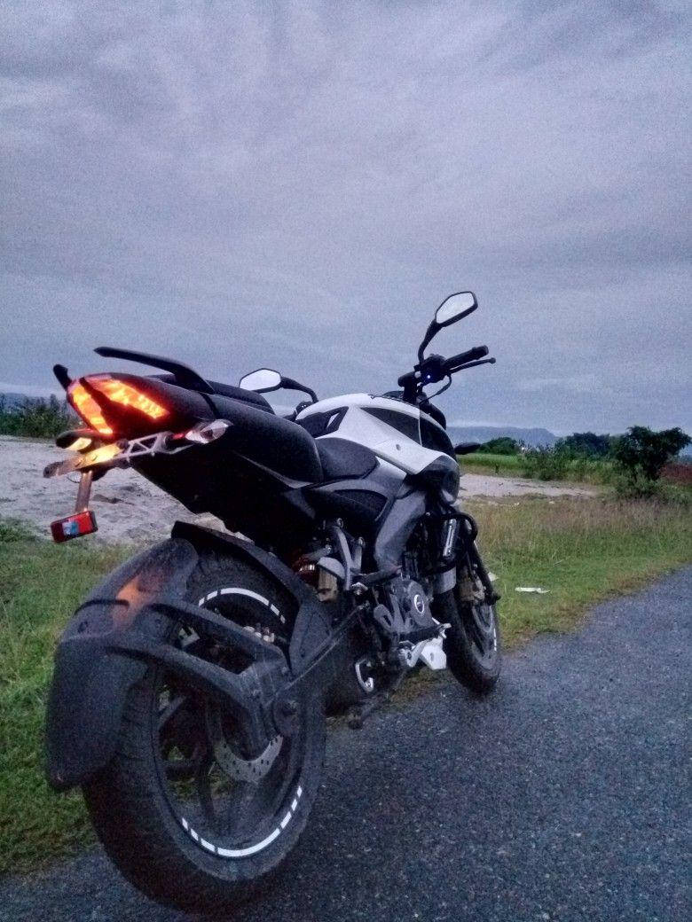 Ns 200 Motorcycle Under Overcast Sky Wallpaper