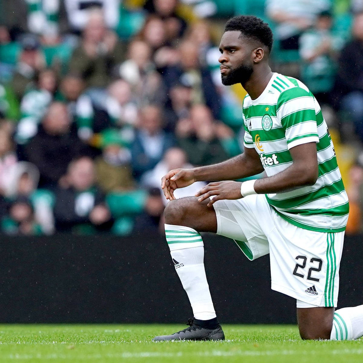 Odsonne Edouard Triumphantly Kneeling On Soccer Field Wallpaper