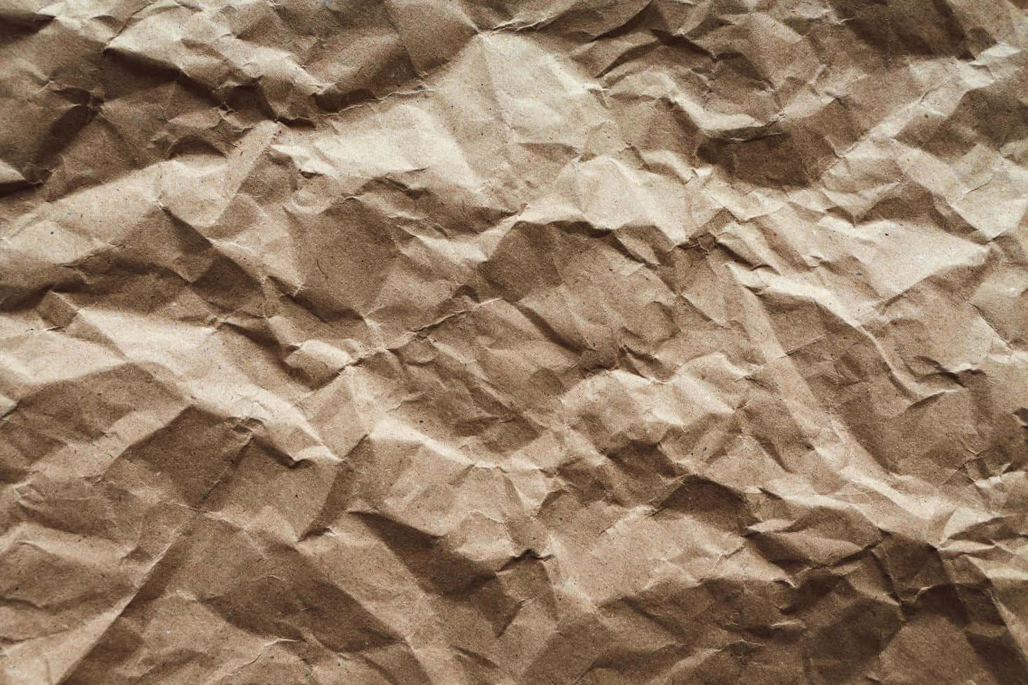 Paper In Brown Color With Crumpled Texture Wallpaper