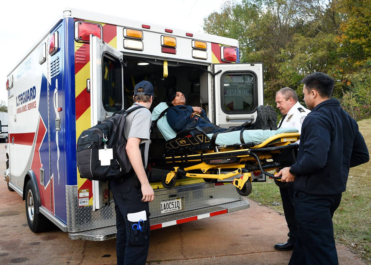 Paramedic Boarding A Patient Wallpaper