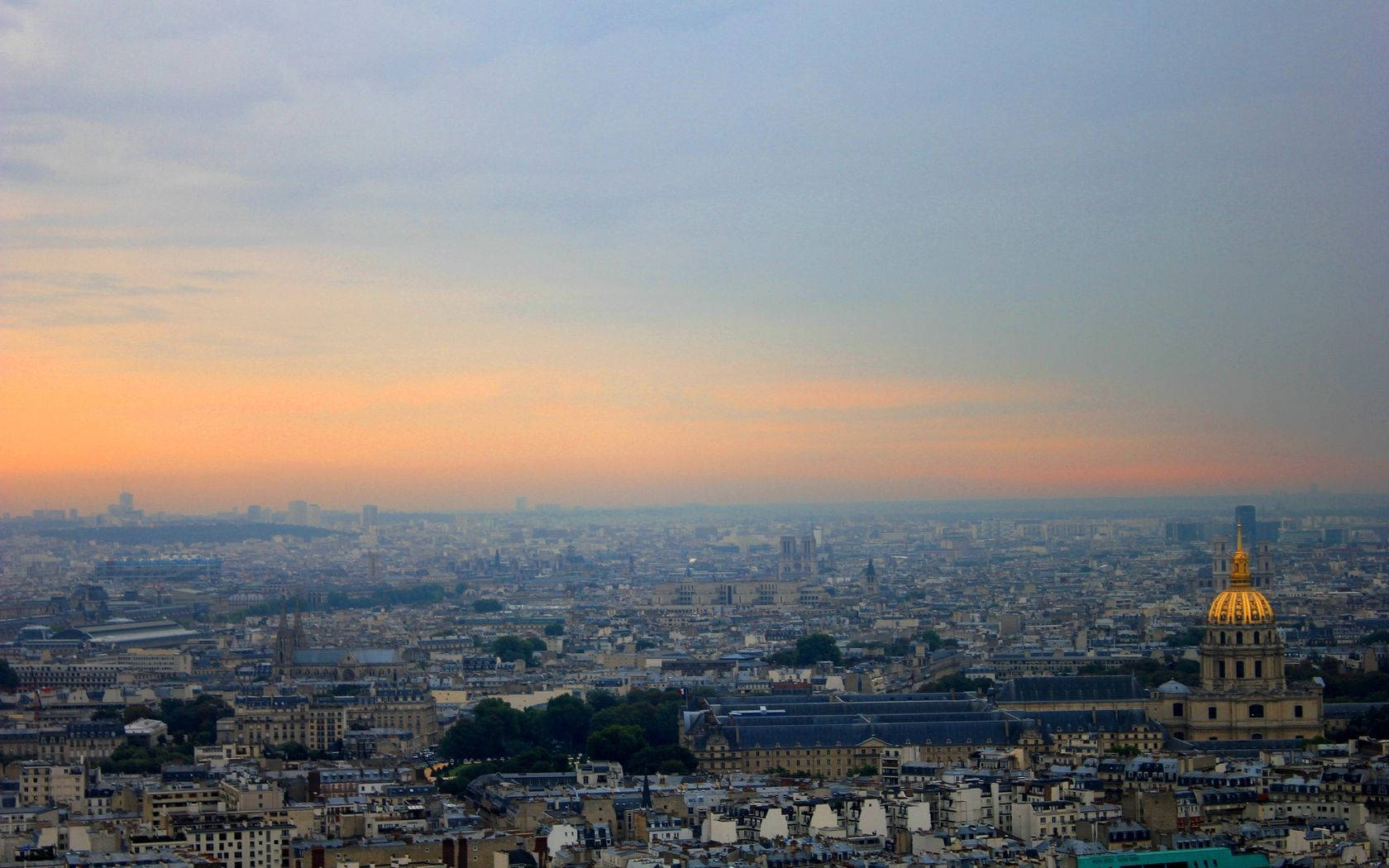 Paris Skyline In Hues Of Calming Blue And Orange. Wallpaper