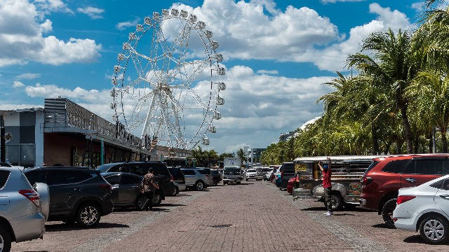 Parking Space With Ferris Wheel Wallpaper