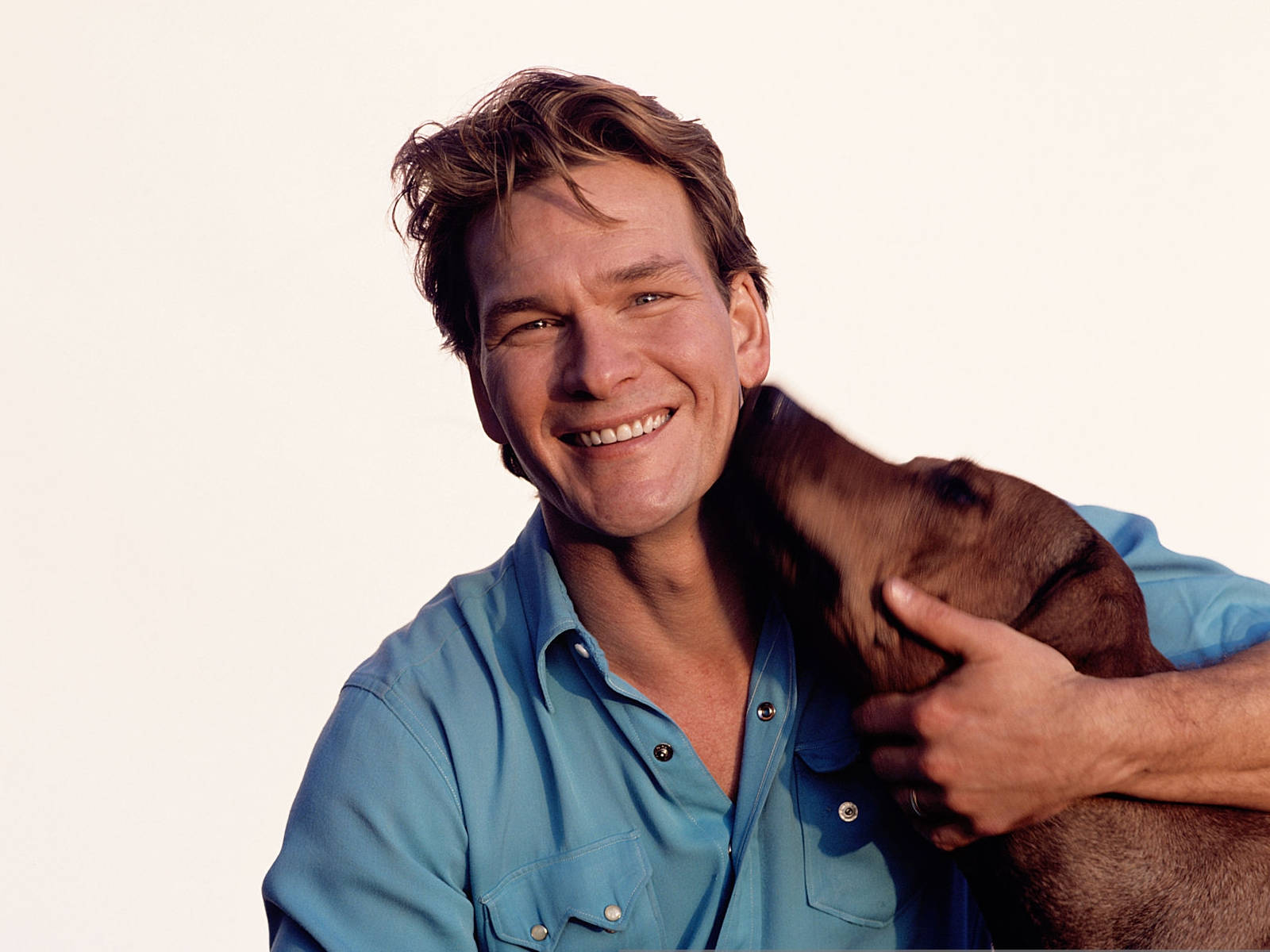 Patrick Swayze American Actor With His Dog Wallpaper