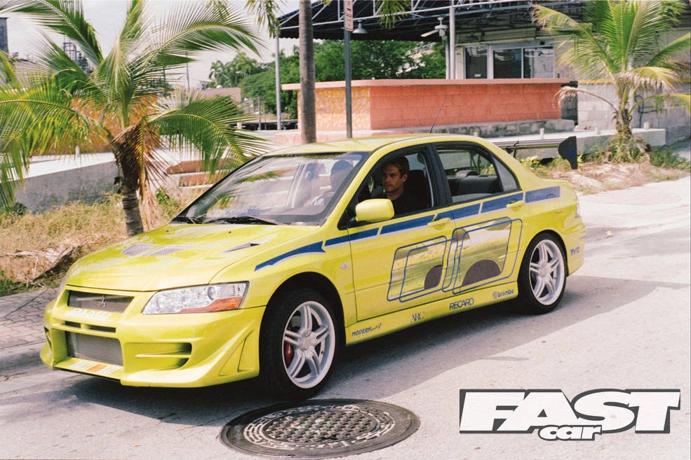 Paul Walker Smiling Next To His Car Wallpaper