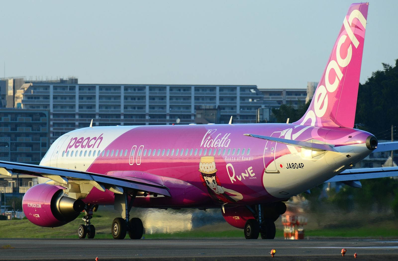 Peach Aviation Plane Preparing To Board Wallpaper