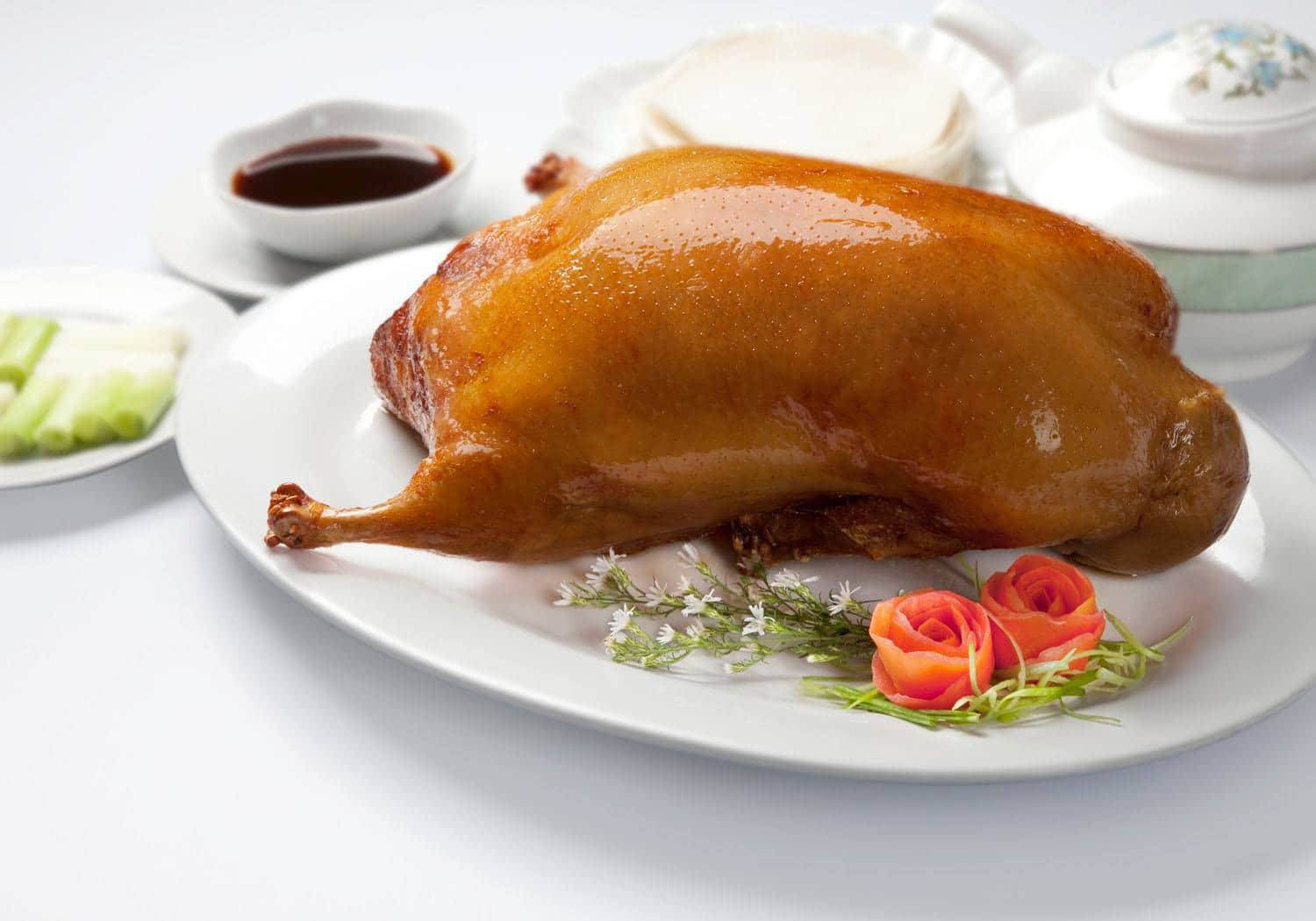 Peking Duck Centerpiece Near White Ceramics Wallpaper