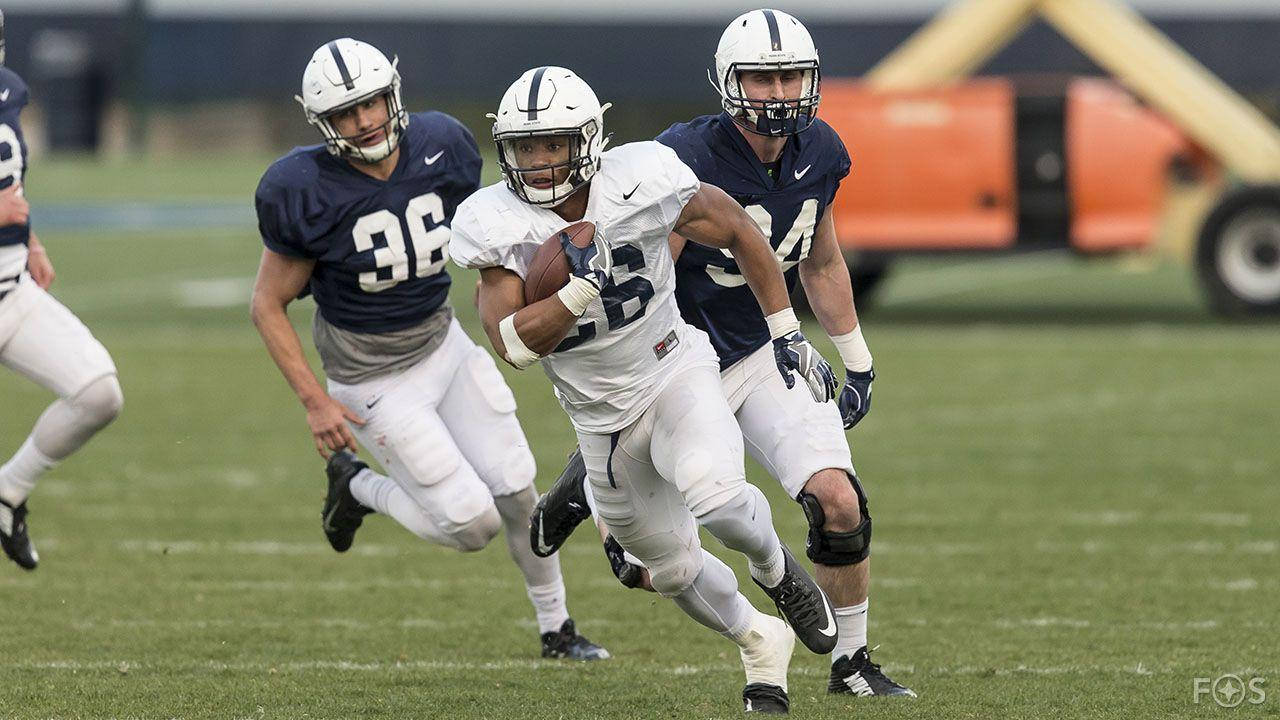 Penn State Football Players Running With The Ball Wallpaper