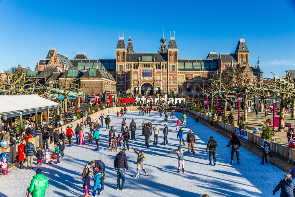 People Ice Skating Outside Rijksmuseum Wallpaper