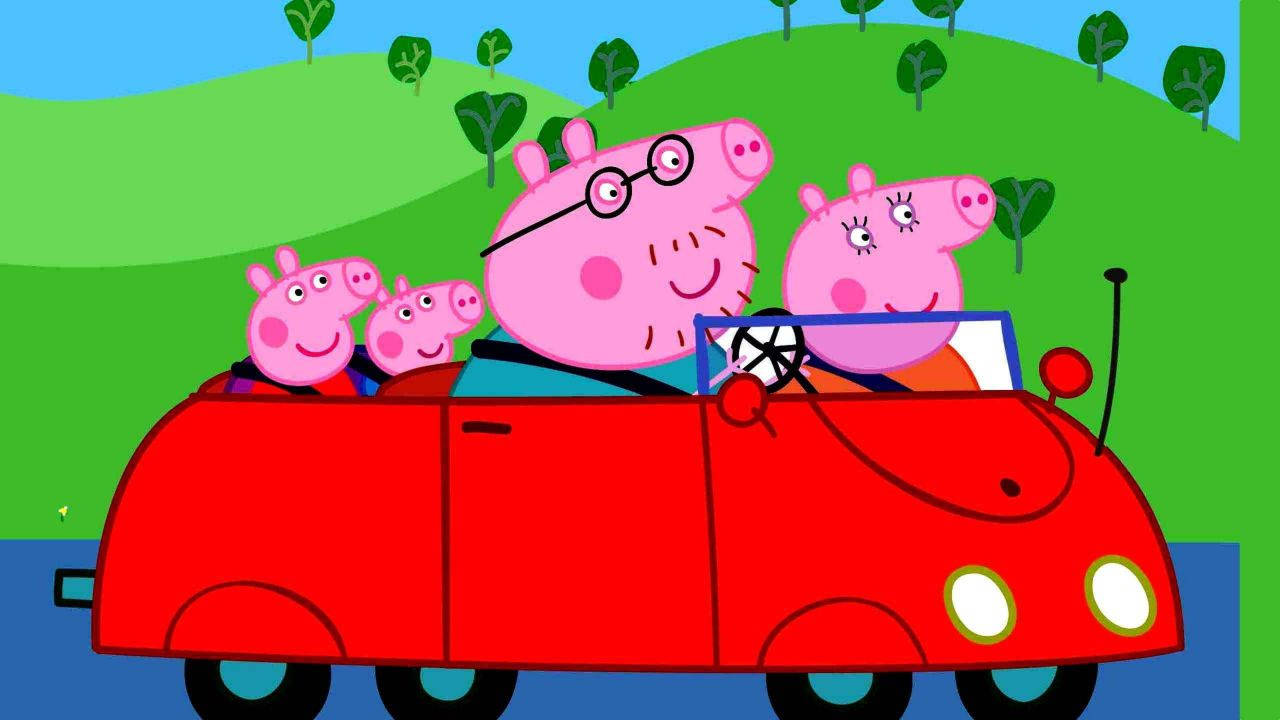 Peppa Pig Family On A Joyous Drive Playing On A Tablet Wallpaper