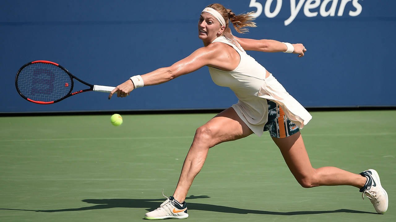 Petra Kvitova Reaching The Tennis Ball Wallpaper