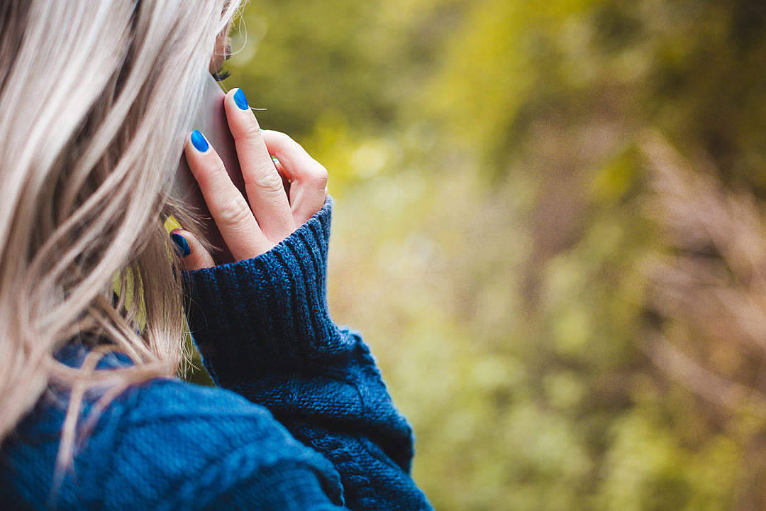Phone Call Woman With Blue Sweater Wallpaper