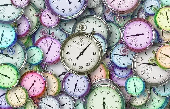 Pile Of Colorful Watches Tiempo Background Wallpaper