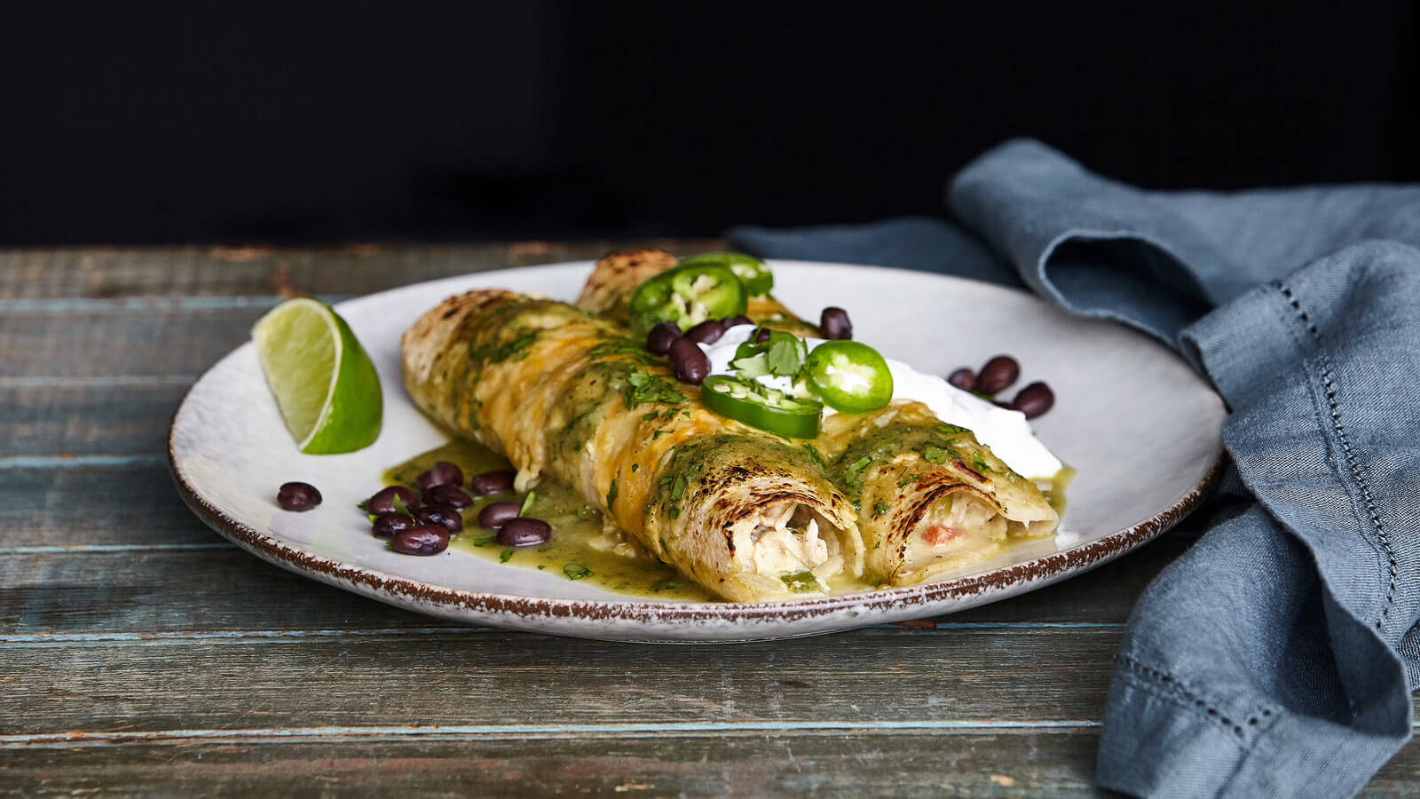 Plate Of Spicy Enchiladas With Black Beans Wallpaper