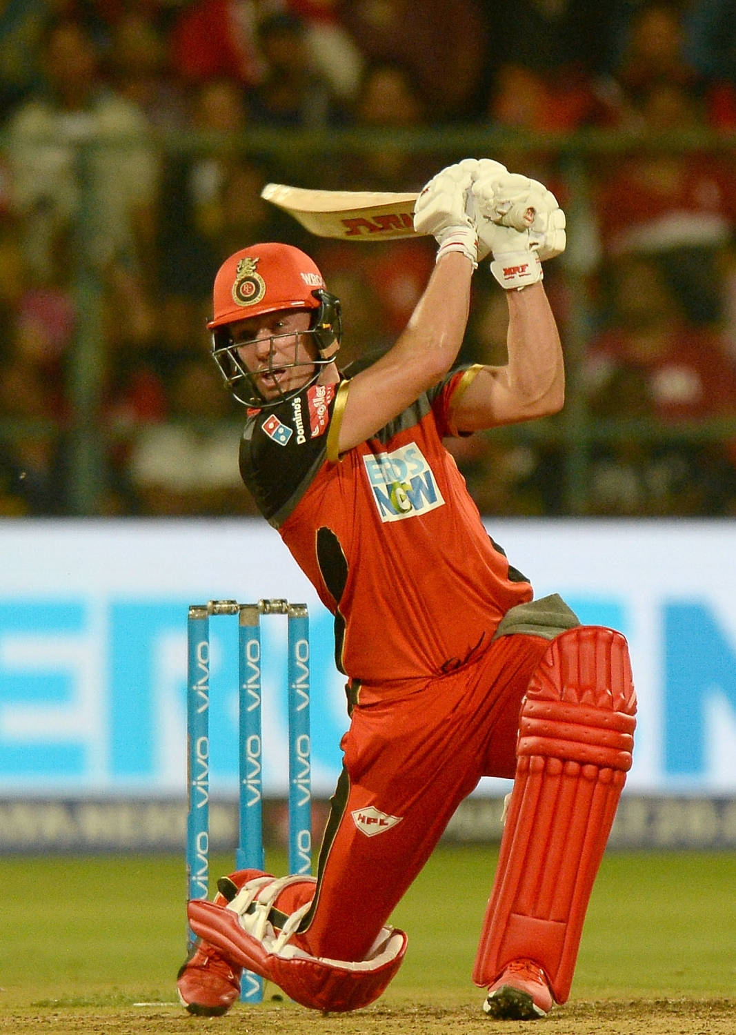 Power Stance - The On-field Strength Of Ab De Villiers In Rcb Gear Wallpaper