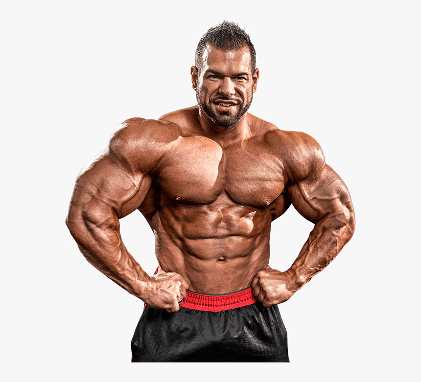 Powerful Bodybuilder Showcasing His Biceps In Hd Resolution Wallpaper