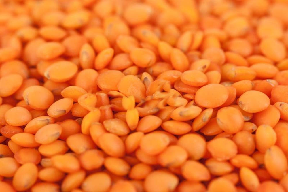 Precise Close-up Of Vibrant Orange Lentils Wallpaper