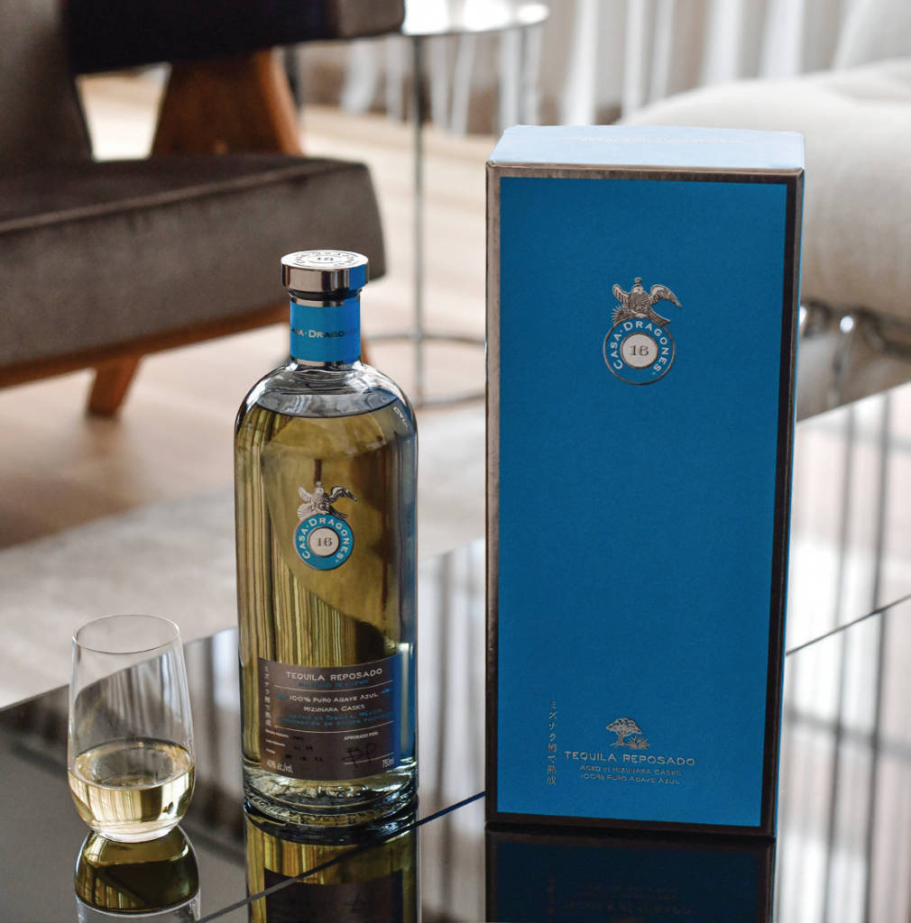 Premium Casa Dragones Tequila Reposado In Elegant Display Wallpaper